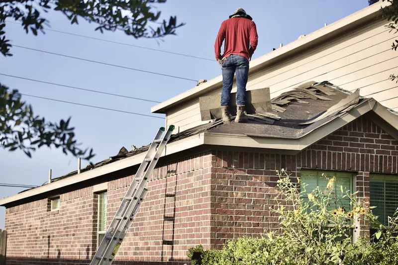Professional roofer working on a residential roof in Shacktown
